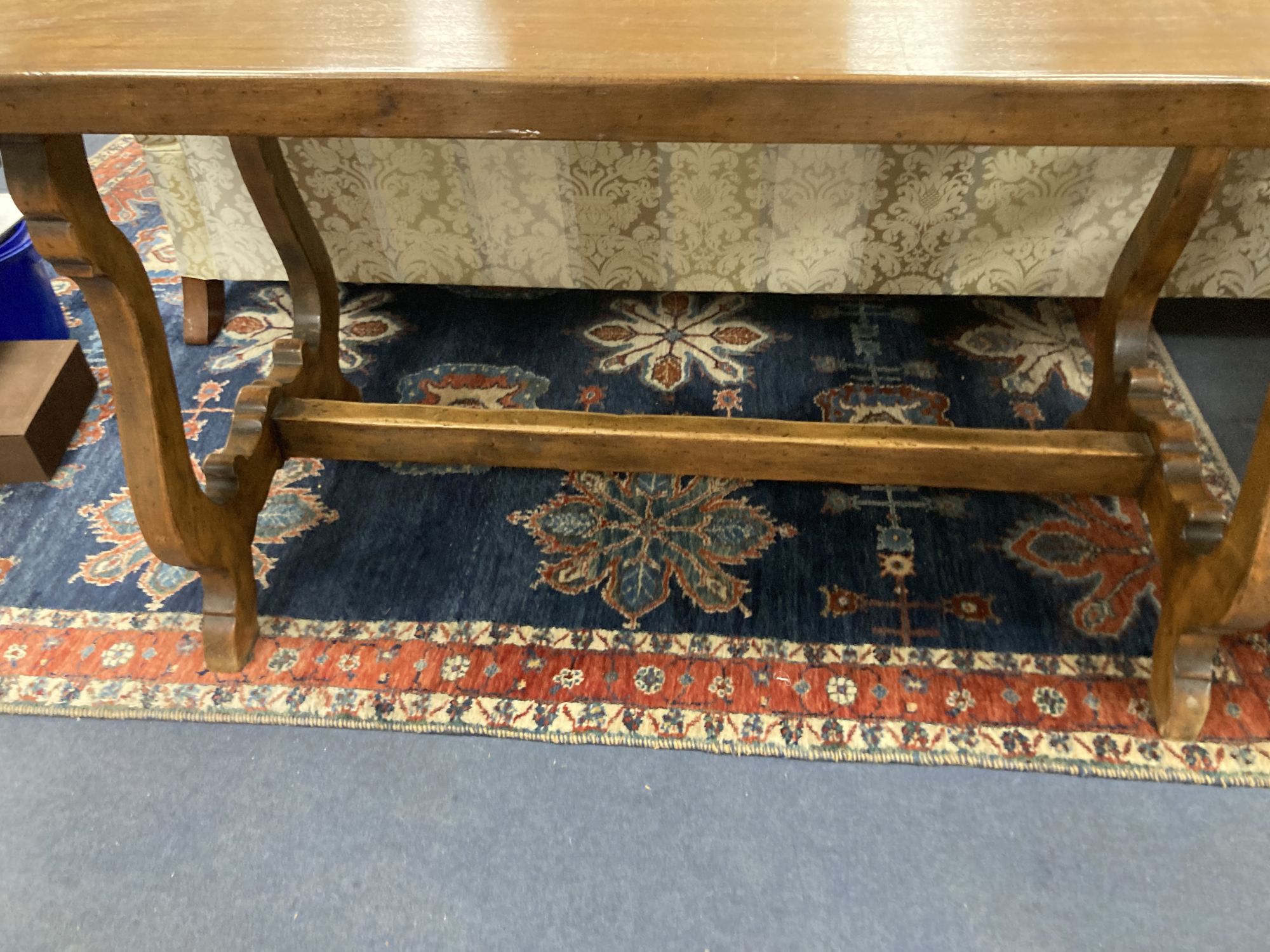 An 18th century Tuscany walnut dining table, with a later top, width 175cm, depth 70cm, height 80cm